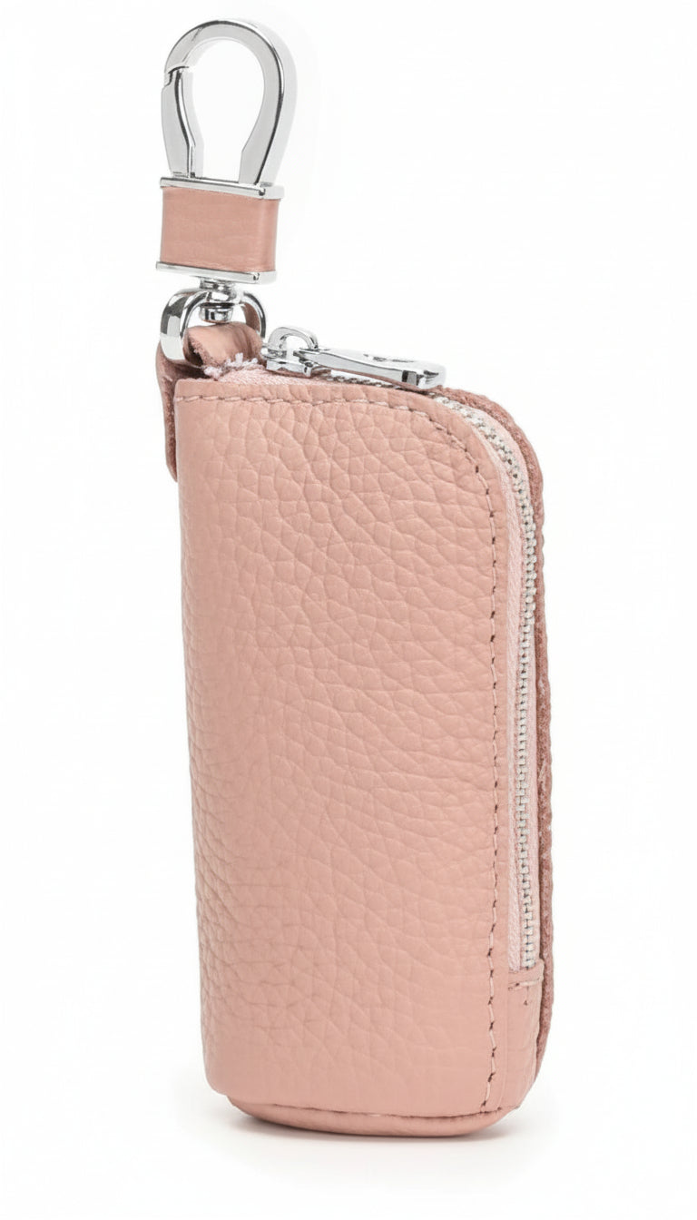 Pink leather key case with silver clip on a white background