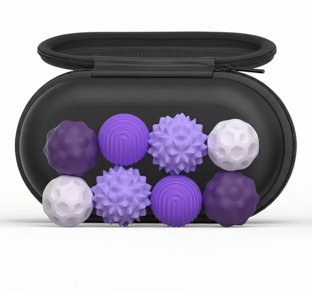 Silicone magnetic sensory balls with a black carrying case on a white background